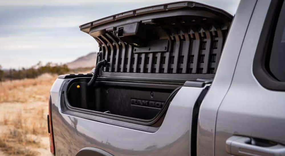 A Ram Box is shown on a silver 2023 Ram 1500 Big Horn.