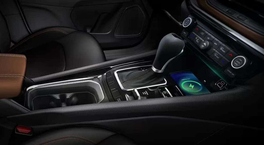 The black center console area in a 2024 Jeep Compass is shown.