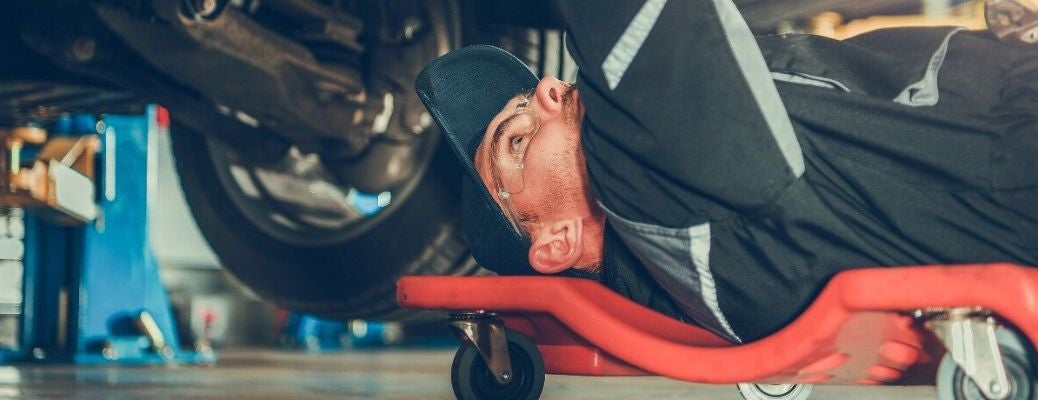 Mechanic checking transmission