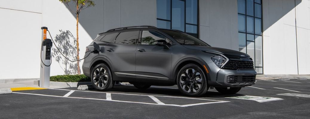 side view of the 2025 Kia Sportage plug-in hybrid being charged