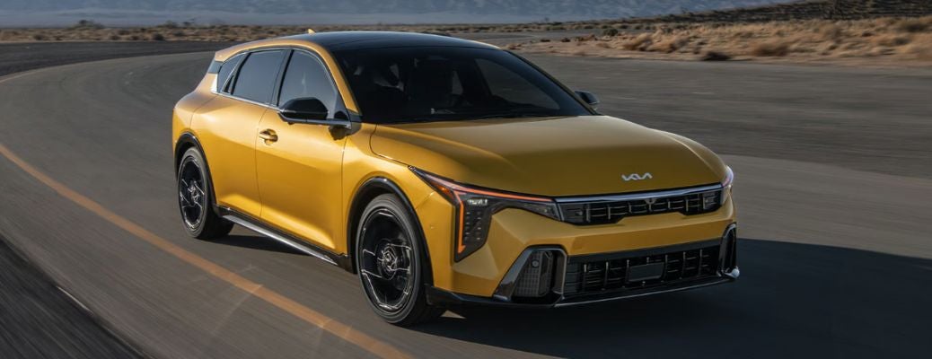 front view of the 2026 Kia K4 Hatchback on the road