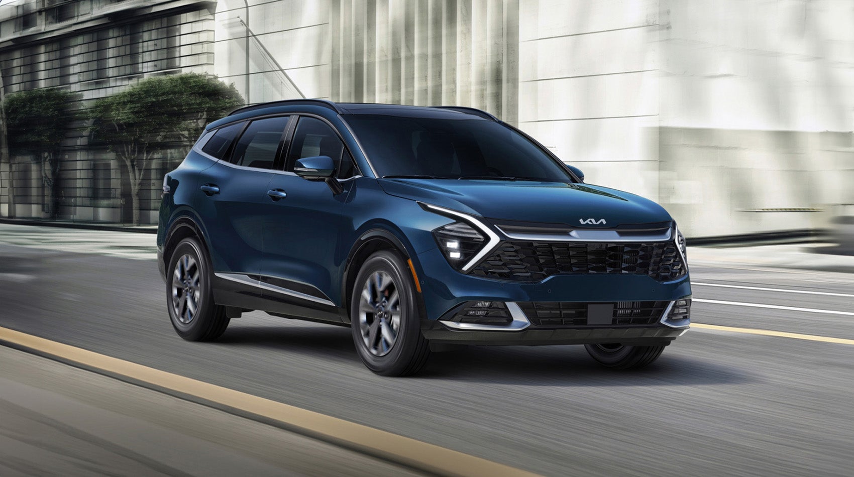 Blue Kia driving on road