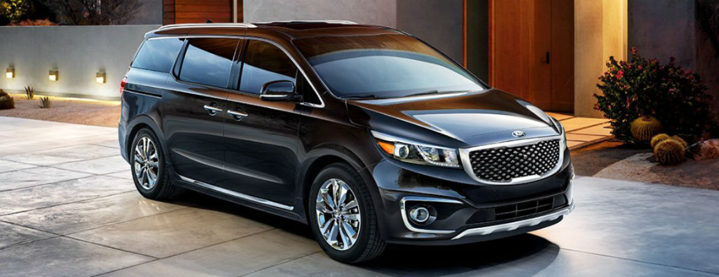 2018 Kia Sedona parked in front of a building