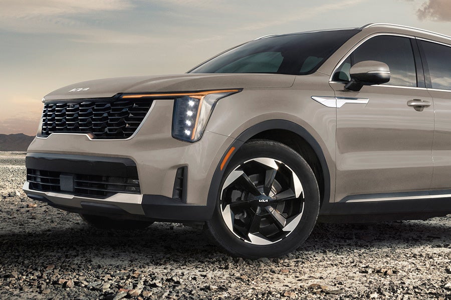 Kia Telluride SUV front side view on rocky terrain