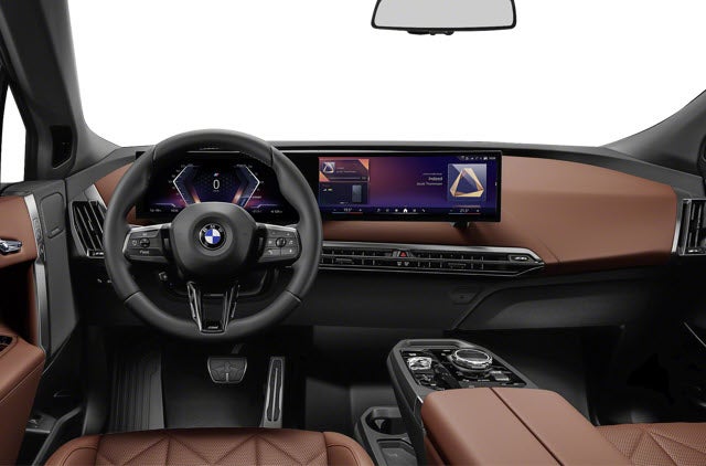 2026 BMW iX SUV interior with a leather brown dashboard, modern display screen, and steering wheel.