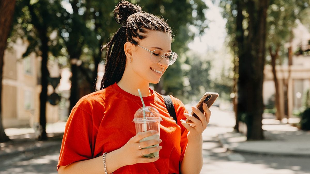 teen with summer job looking at her phone