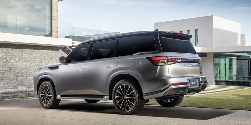 QX80 parked in front of a house