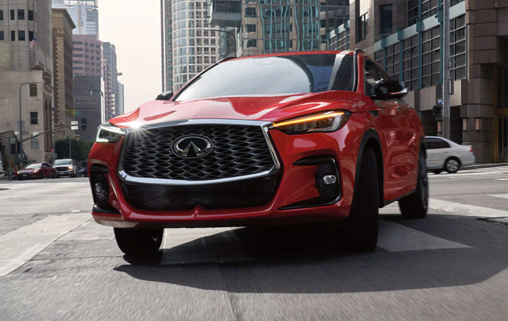 Infiniti driving in a city