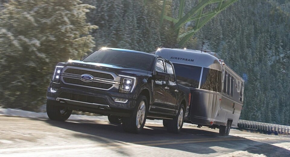 Ford F-150 pulling an airstream trailer in the winter time