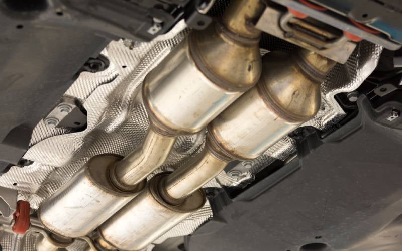 close up of catalytic converter under vehicle