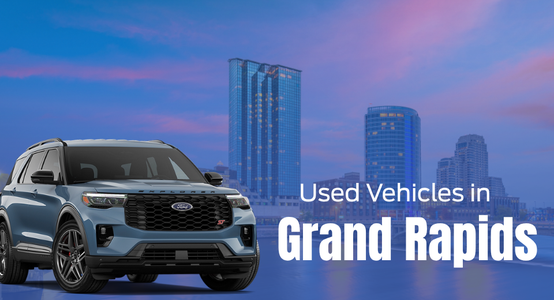 Quality used cars for sale at Borgman Ford in Grand Rapids, Michigan shown against the Grand Rapids MI skyline at night