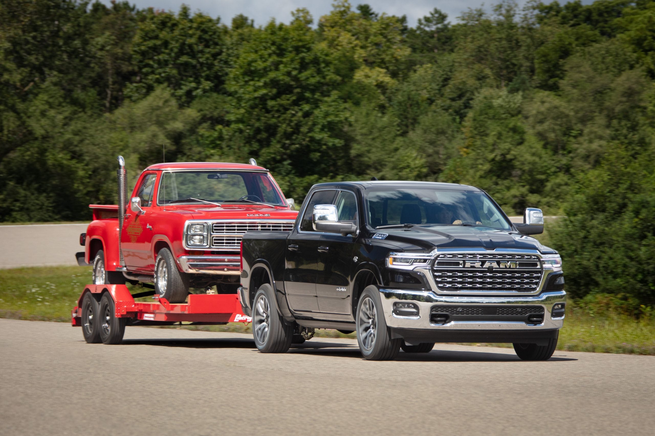 2026 RAM 1500 towing a vintage truck