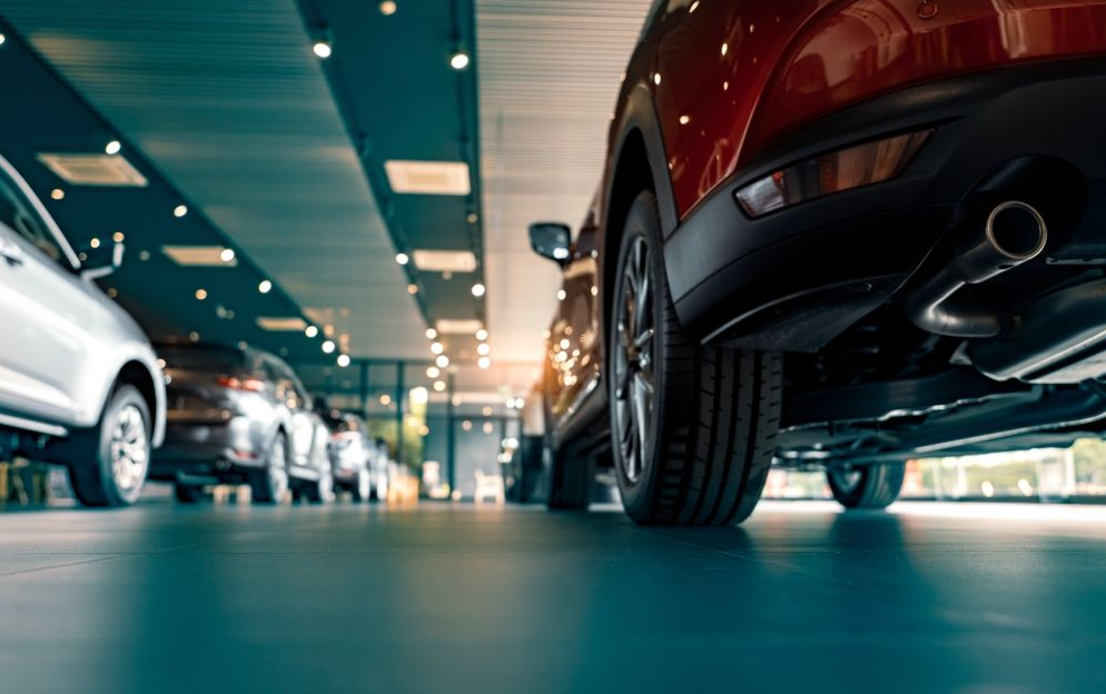 A photo of the inside of a car dealership.