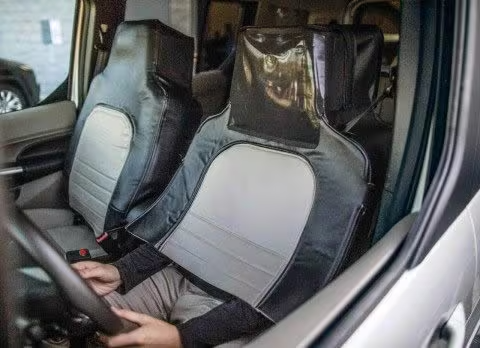 A driver disguises himself as a car seat to test people's reaction to a Ford Autonomous Vehicle