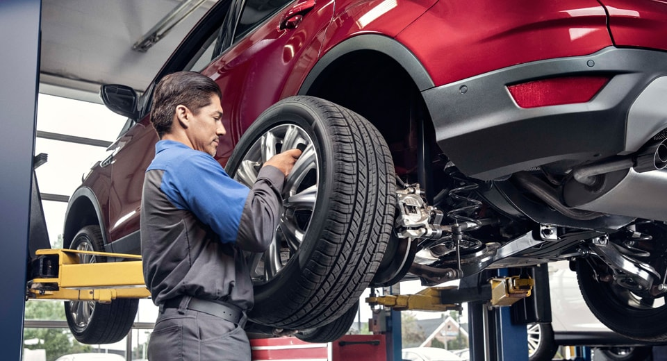 Service Technician with tire