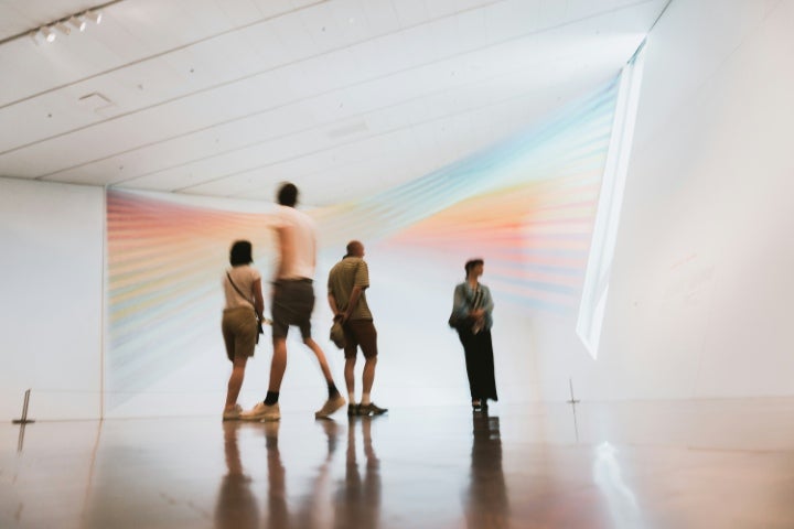 Art museum with people in the background.