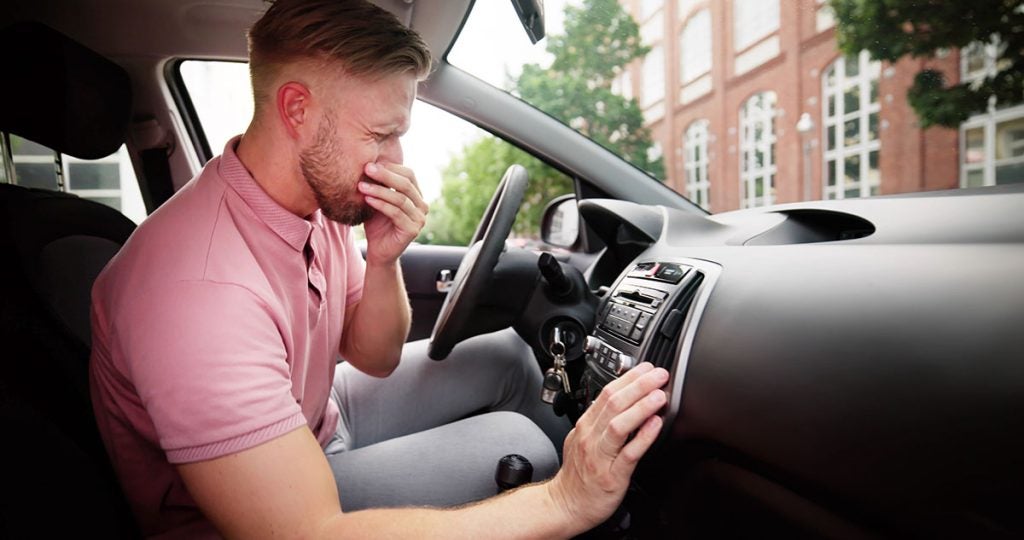 why do i smell gas in my car or truck when i start it?