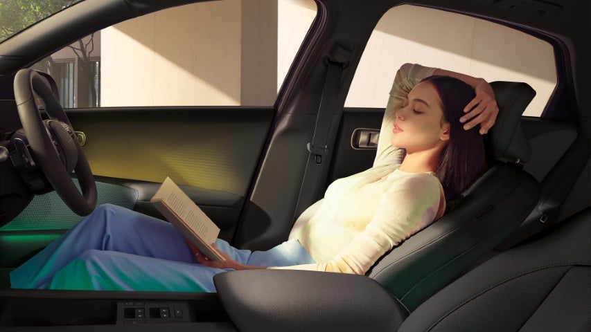 Woman sitting comfortably in the passenger seat.