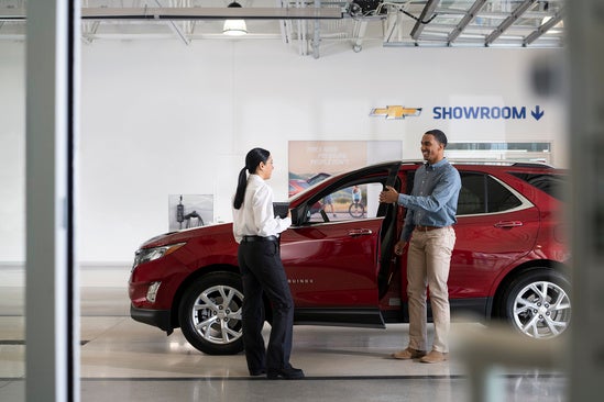 customer exiting their Chevrolet being serviced at Chuck Hutton Chevrolet
