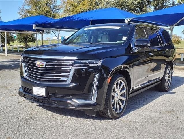 used Cadillac Escalade SUV parked in dealership lot