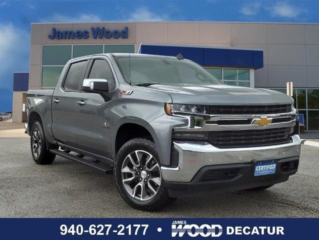 light gray pre owned Silverado parked in dealership lot