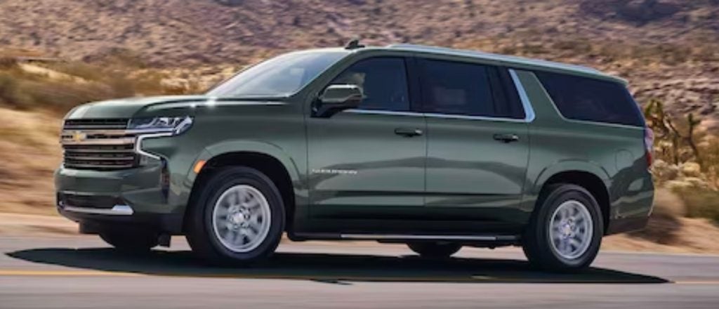 green Chevrolet Suburban driving off road in the desert