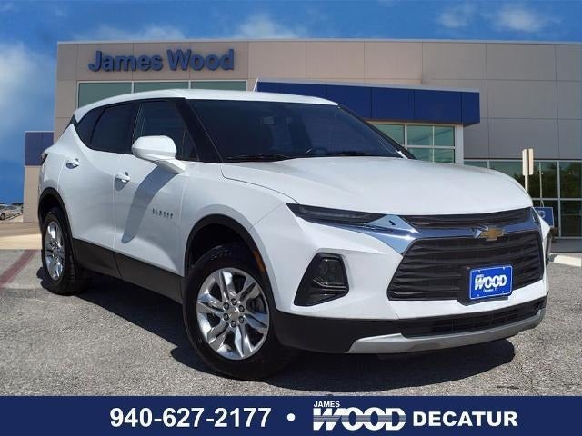 pre-owned white chevrolet parked in dealership lot