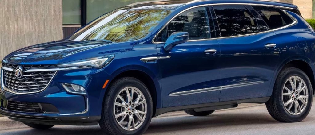 blue Buick Enclave parked in a suburban driveway