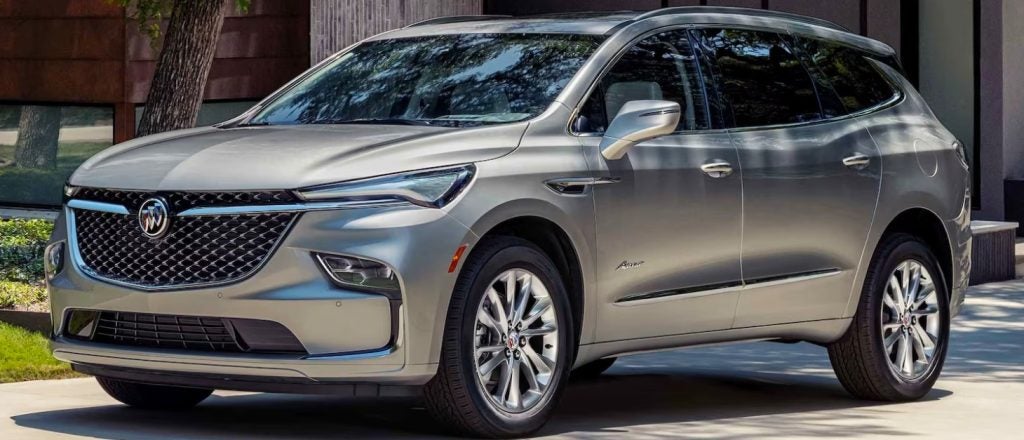 tan Buick Enclave parked in a suburban driveway