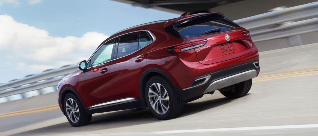 red Buick Envision driving on a highway