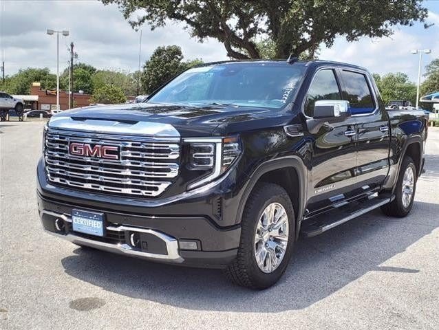used GMC pickup truck parked in the dealership lot