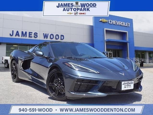corvette parked in front of the James Wood dealership