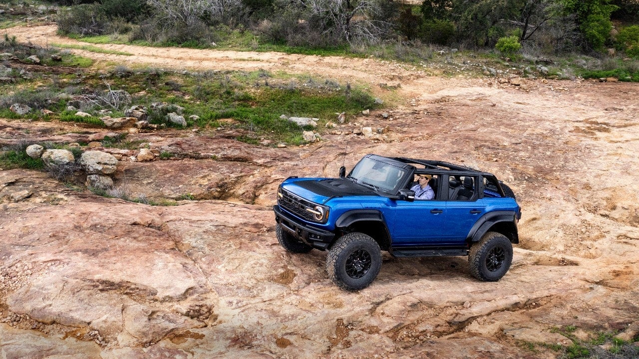 Blue Ford Bronco Raptor offroad