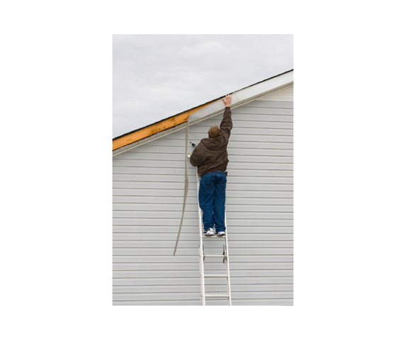 roof repair - man on ladder 