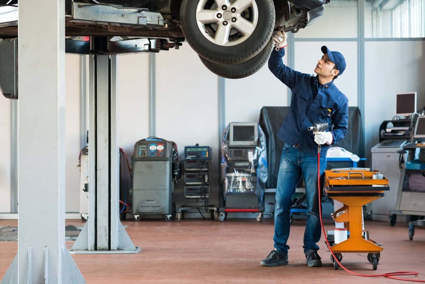 Service Technician Working Under Vehicle