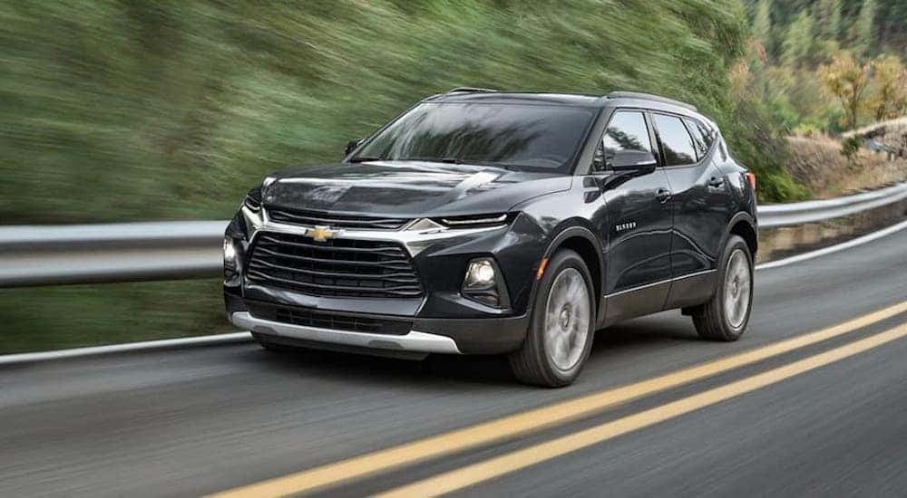 A black 2021 Chevy Blazer is shown driving.