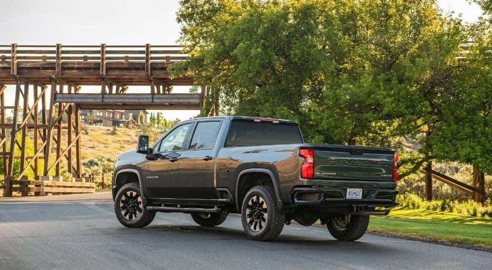 A grey 2020 Chevy Silverado 2500 Custom is shown from the rear at an angle.
