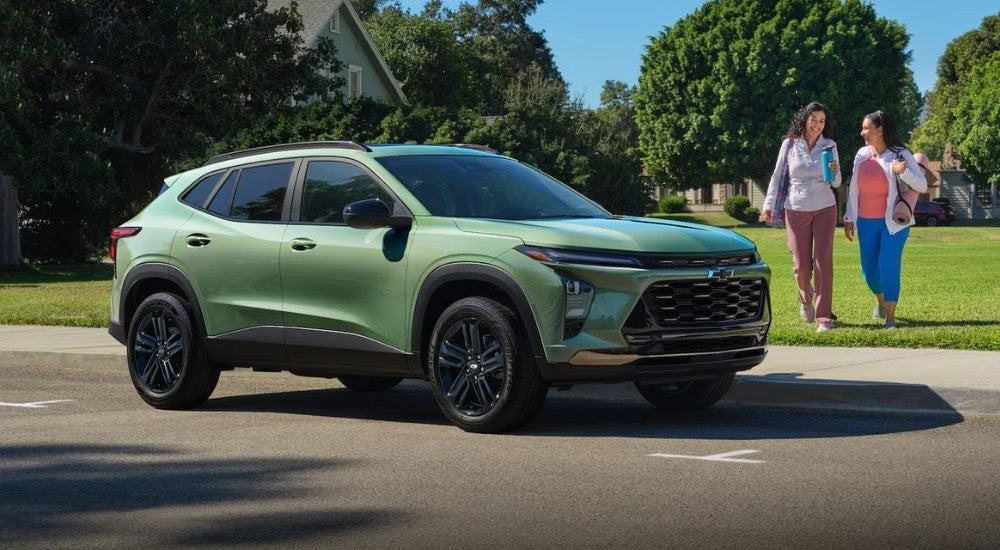 Green 2025 Chevy Trax ACTIV near a park