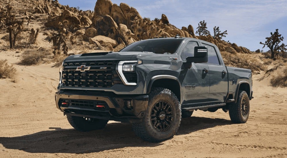 Green 2026 Chevy Silverado 2500 HD ZR2 parked off road