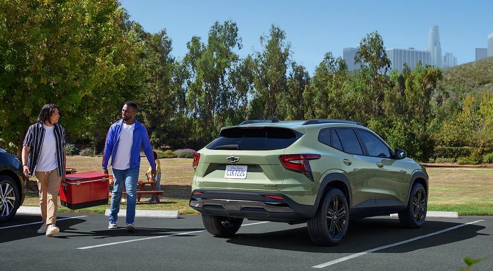 Rear of a green 2026 Chevy Trax ACTIV parked on a parking lot.
