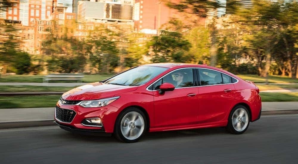 A red 2016 Chevy Cruze RS is shown from the side.