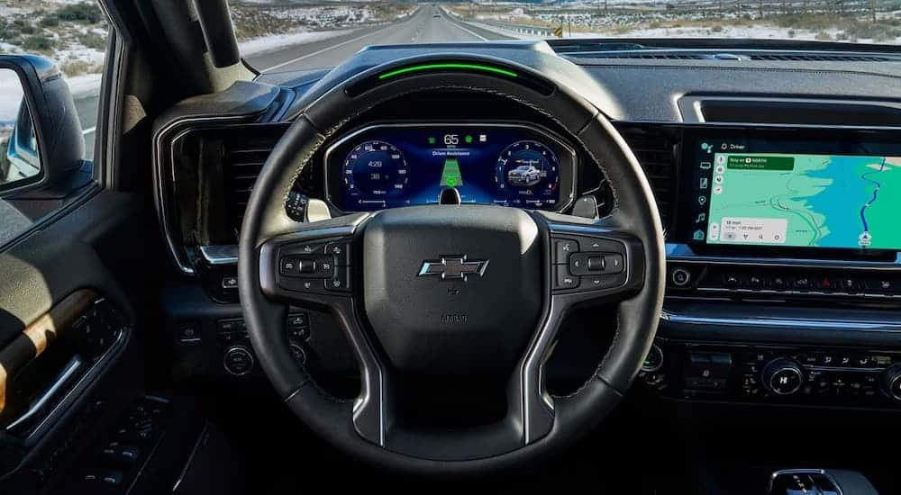 Infotainment and digital gauge cluster on a 2026 Chevy Silverado 1500 vs 2026 Ford F-150