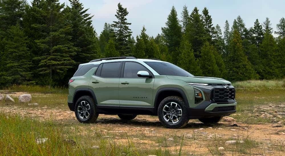 A green 2026 Chevy Equinox ACTIV parked off-road