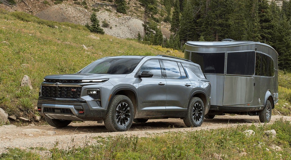 Silver 2026 Chevy Traverse Z71 towing a camper