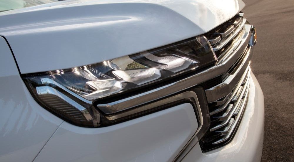 Passenger side headlight on a white 2023 Chevy Suburban