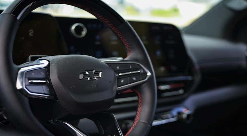 Close-up of a steering wheel in a 2025 Chevy Silverado 1500 EV RST for sale.