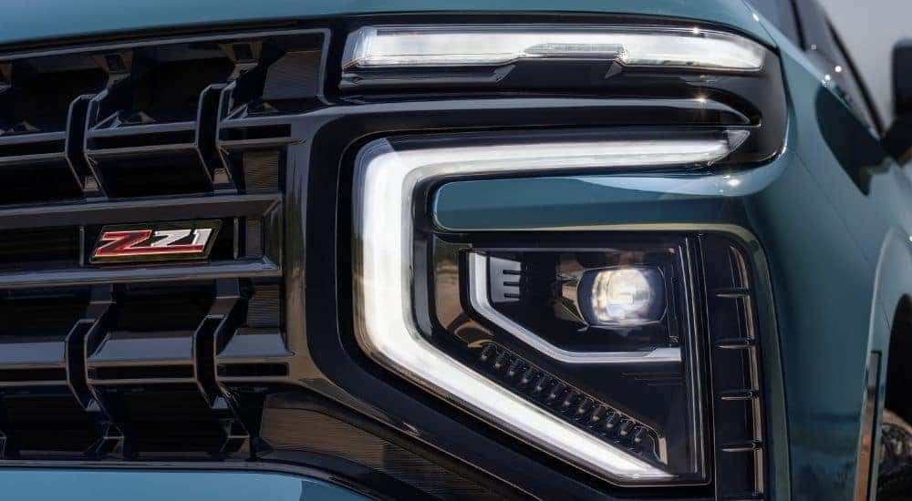 A close up shows the driver side fog light on a green 2025 Chevy Tahoe Z71.