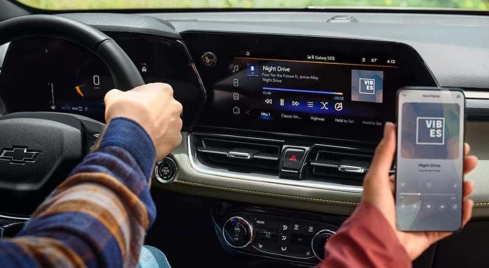 A close-up of the infotainment screen is shown in a 2025 Chevy Trailblazer.