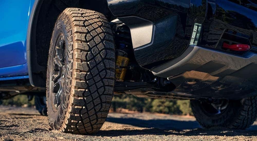 A close up of the underneath of a blue 2024 Chevy Silverado 1500 ZR2.