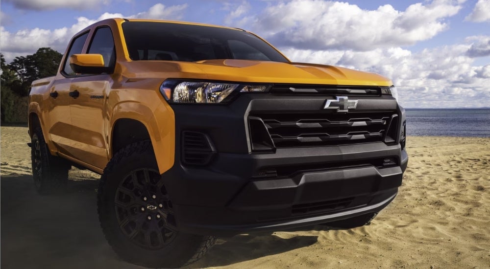 Yellow 2026 Chevy Colorado for sale in Birmingham parked near a lake
